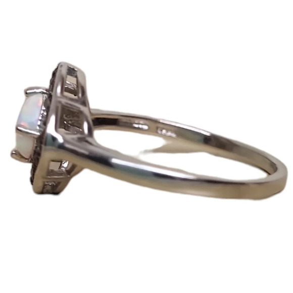 Sterling Silver Garnet Created White Opal Flower Ring - Picture 14 of 16